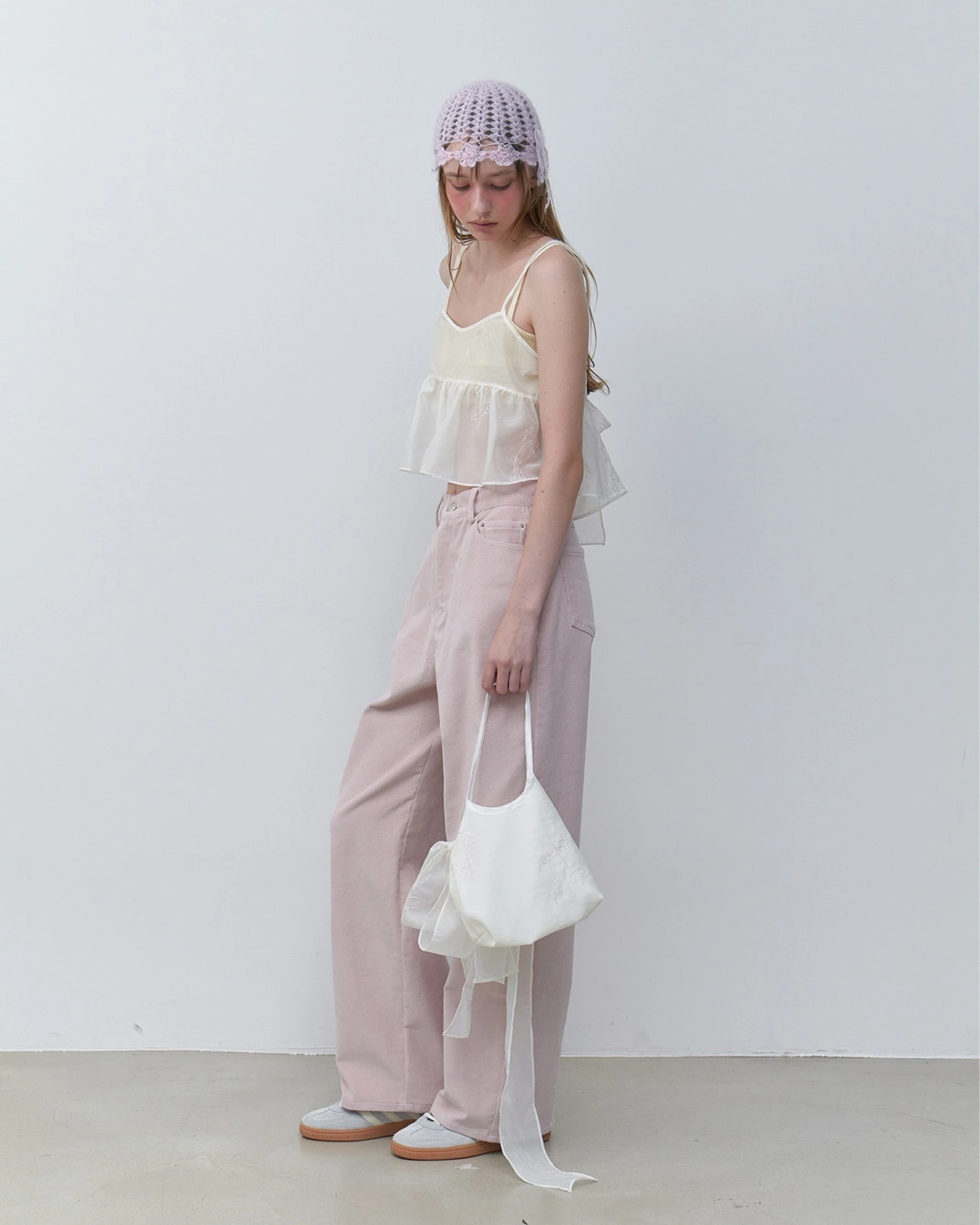 Lookbook input showing pink trousers and a pale top
