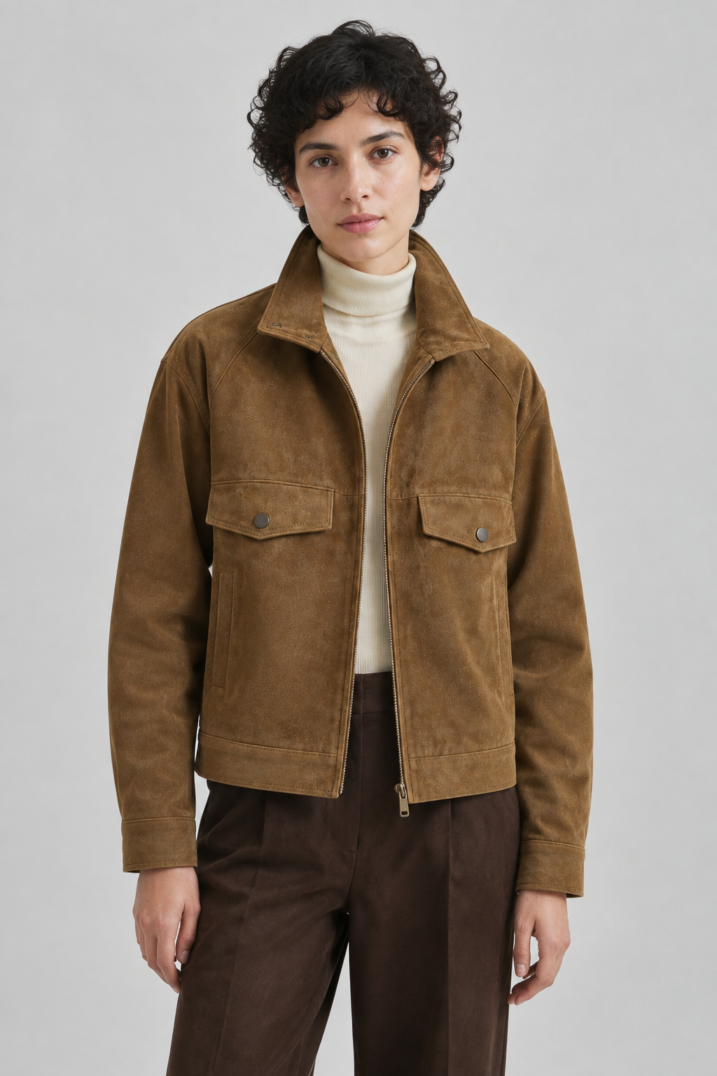 Product demonstration: brown jacket in a soft studio portrait, generated after exploring directions.